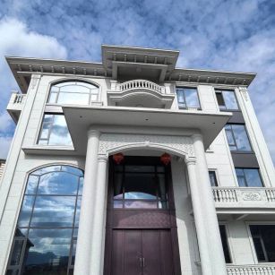 海南白麻别墅外墙干挂石材效果示例