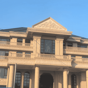 海南黄金麻别墅外墙干挂石材效果示例